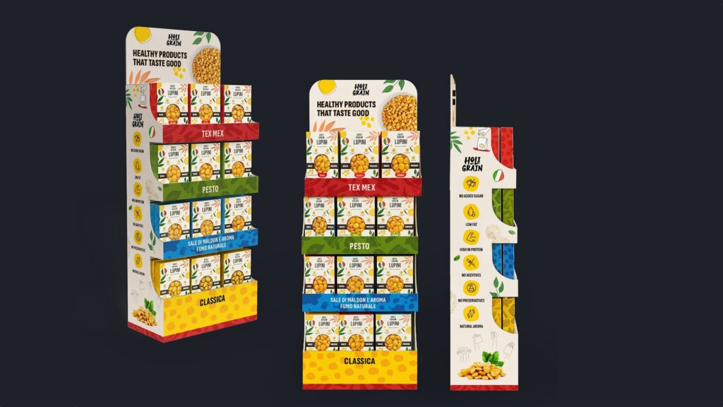Colorful shelf-ready food packaging display featuring a variety of seasoned snack grains in bright retail-ready boxes with primary color branding and vertical presentation tray.