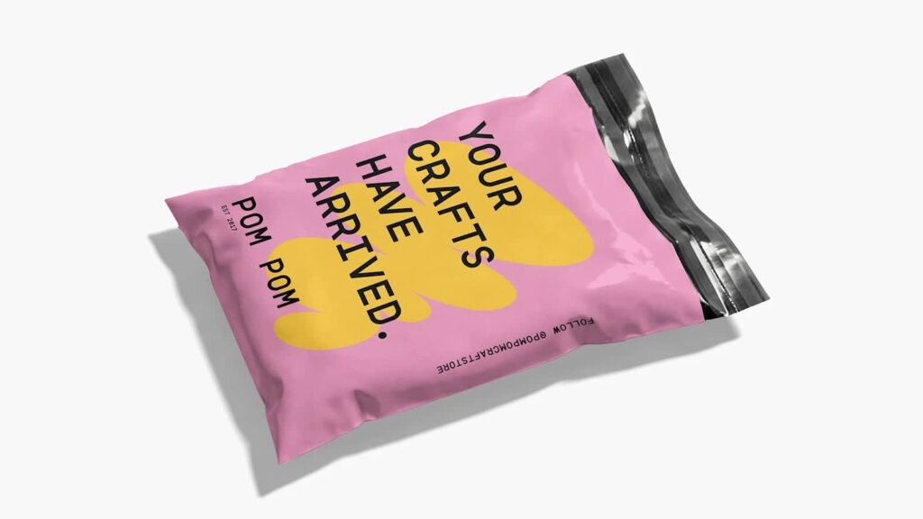 Minimalist packaging design featuring a soft pink pouch with bold black typography, oversized yellow graphic shapes and a clean, high-contrast layout.