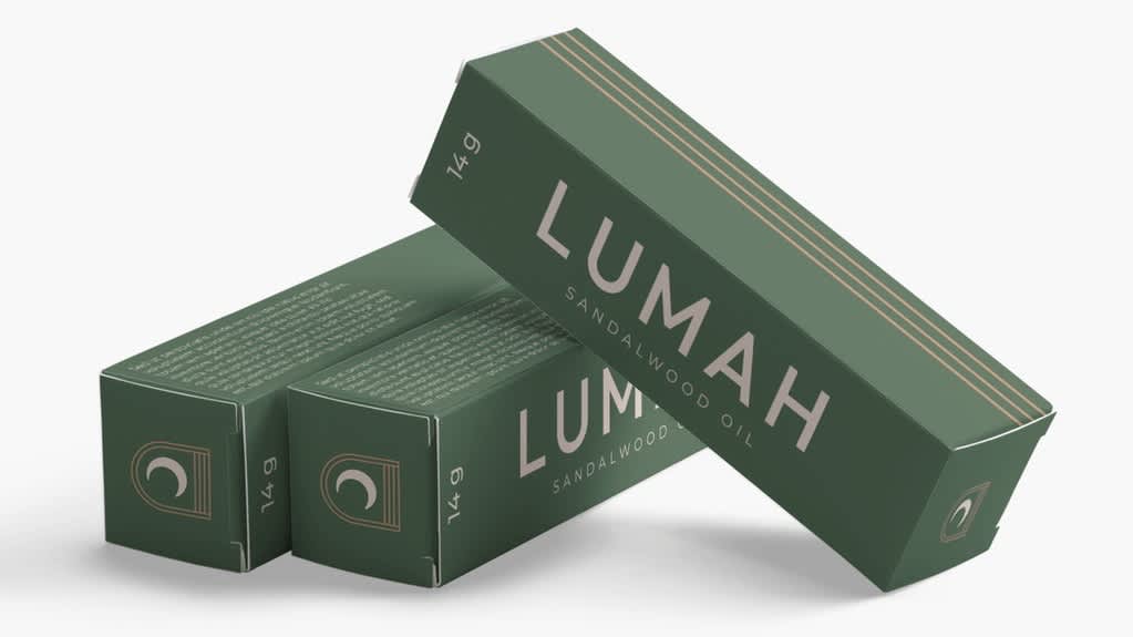 Minimalist packaging design for essential oil featuring dark green rectangular boxes with clean typography, subtle line accents and a limited color palette.
