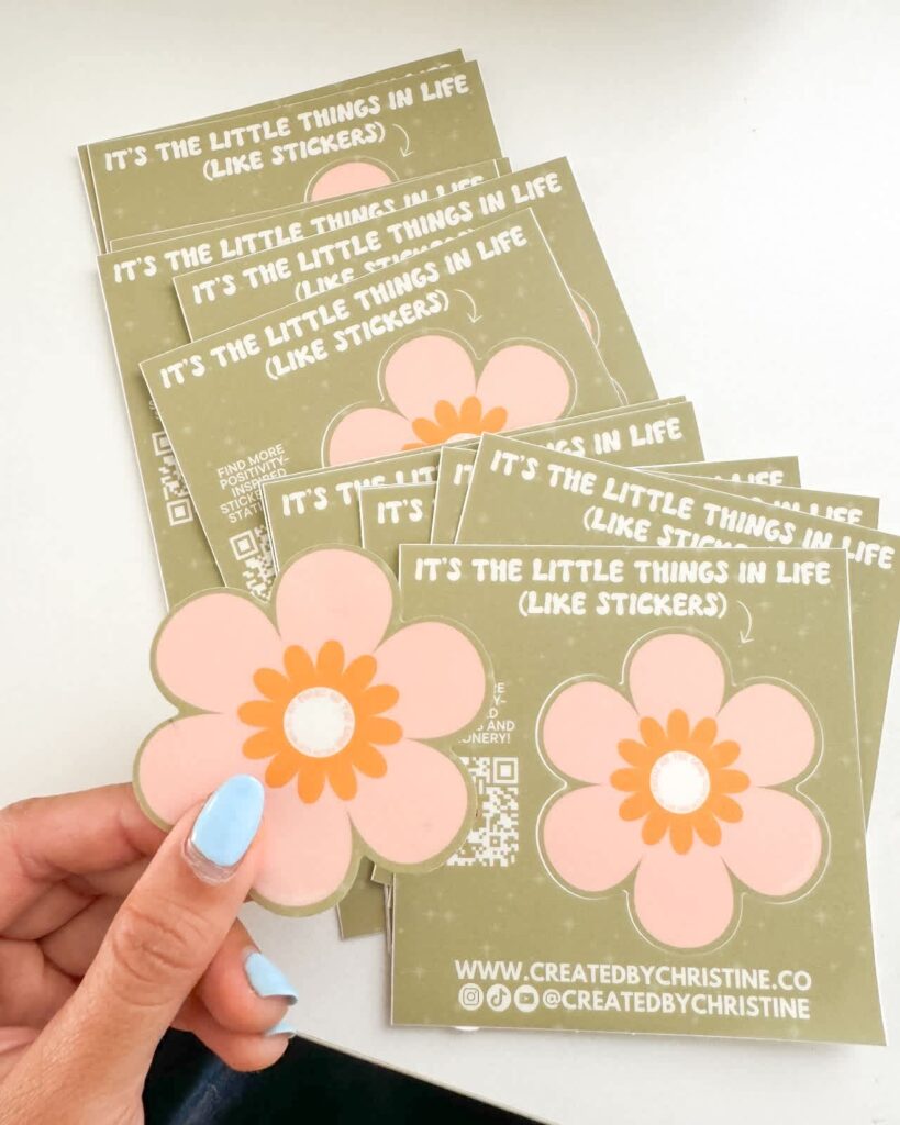 Selection of custom stickers with flower design and QR code.
