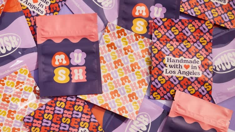 A range of pink and purple branded packaging.