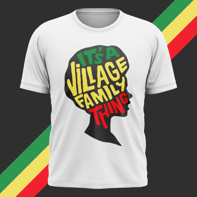 White T-shirt with side profile head silhouette graphic and green, red and yellow font inside &ldquo;It&rsquo;s a Village Family Thing.&rdquo;