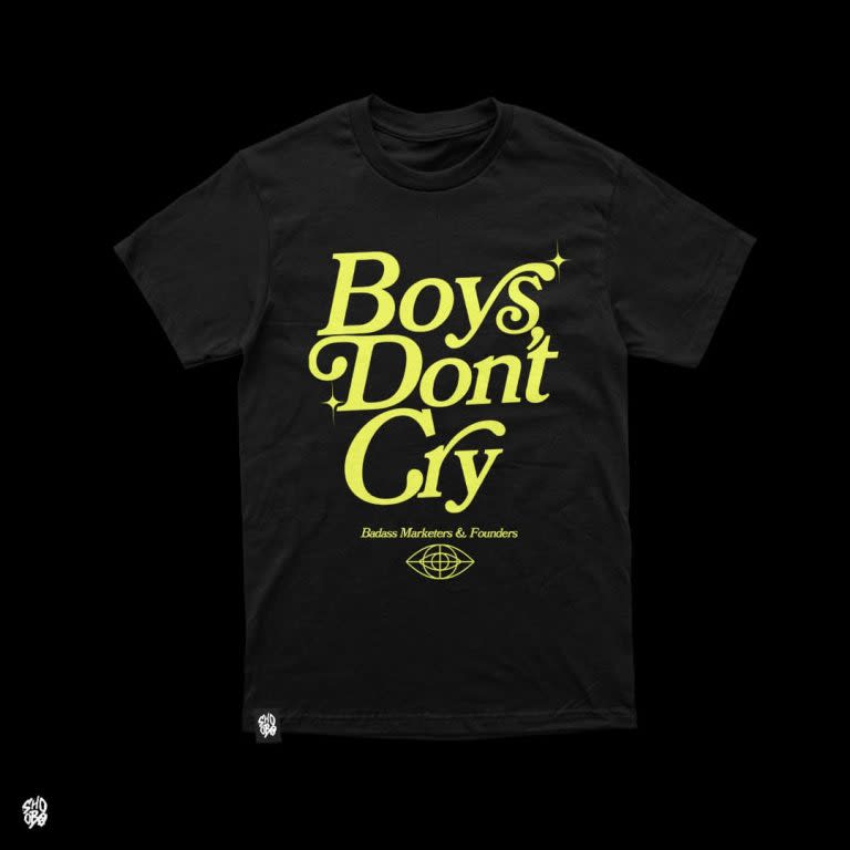 Black T-shirt with yellow font &ldquo;Boys Don&rsquo;t Cry.&rdquo;