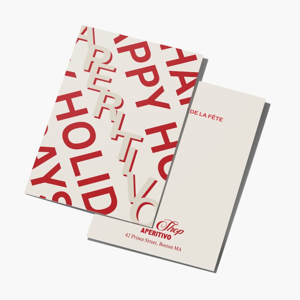 Folded linen Christmas card with bold red typography and blank interior for a handwritten message.