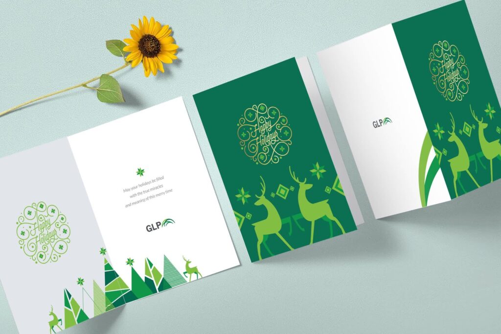 Folding Christmas card with reindeer and green and gold accents for GLP company.