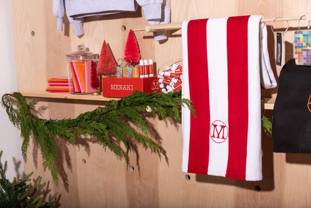 A store with wooden walls decorated with branded red and white festive products.