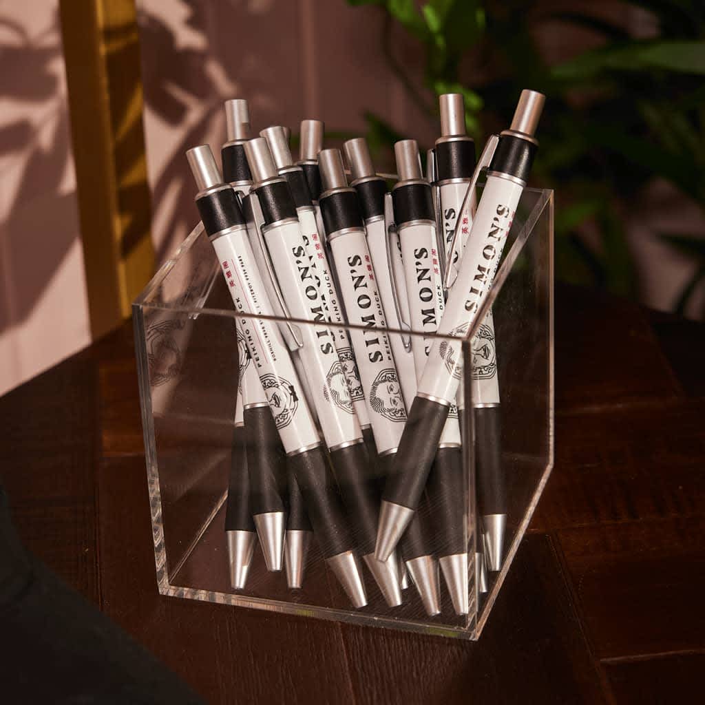 Simon&rsquo;s sleek pens as promotional merch.