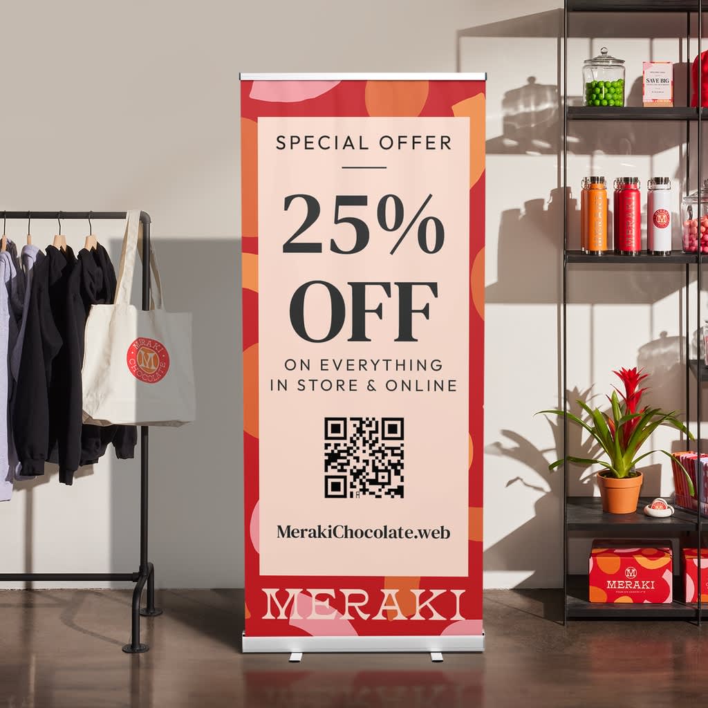 Retractable banner with QR code promoting 25% off holiday sale.