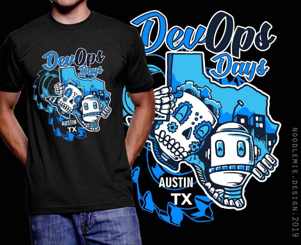 Black T-shirt mockup with a blue and white DevOps Days Austin TX graphic featuring a robot and skull illustration.