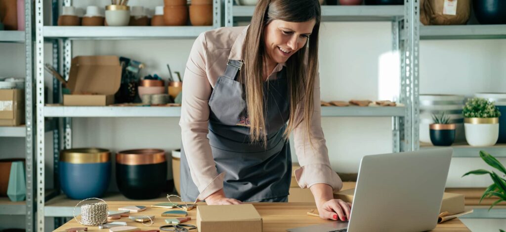 Woman making clay ornaments taking orders online.