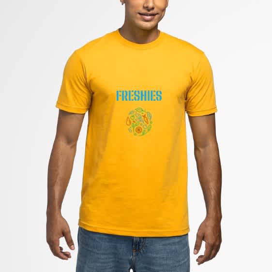 Yellow T-shirt circular fruit and veg graphic and blue font &ldquo;FRESHIES.&rdquo;