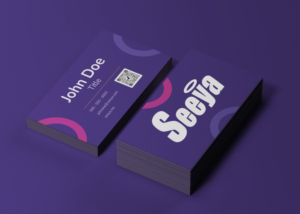 Deep purple business cards with white and pink accents, creating a bold, polished color palette.