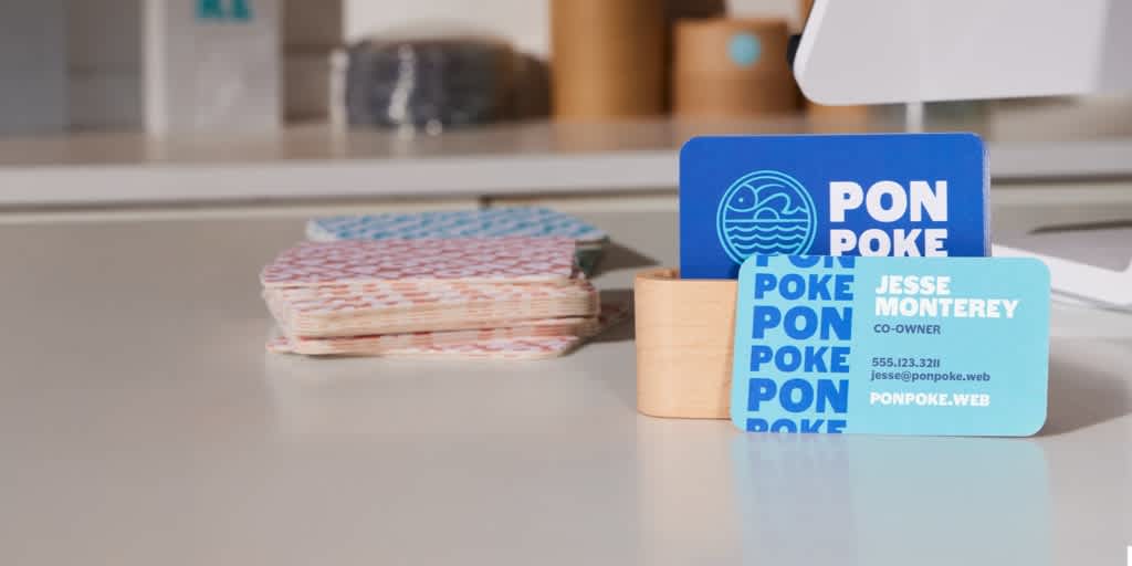 A blue restaurant business card with clear fonts.