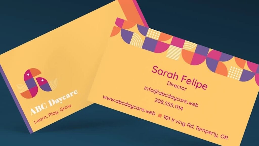 Golden yellow business cards with orange, purple and pink accents, creating a warm, playful color palette.