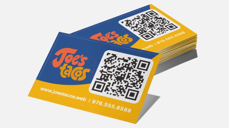 Blue and yellow business cards with a QR code.