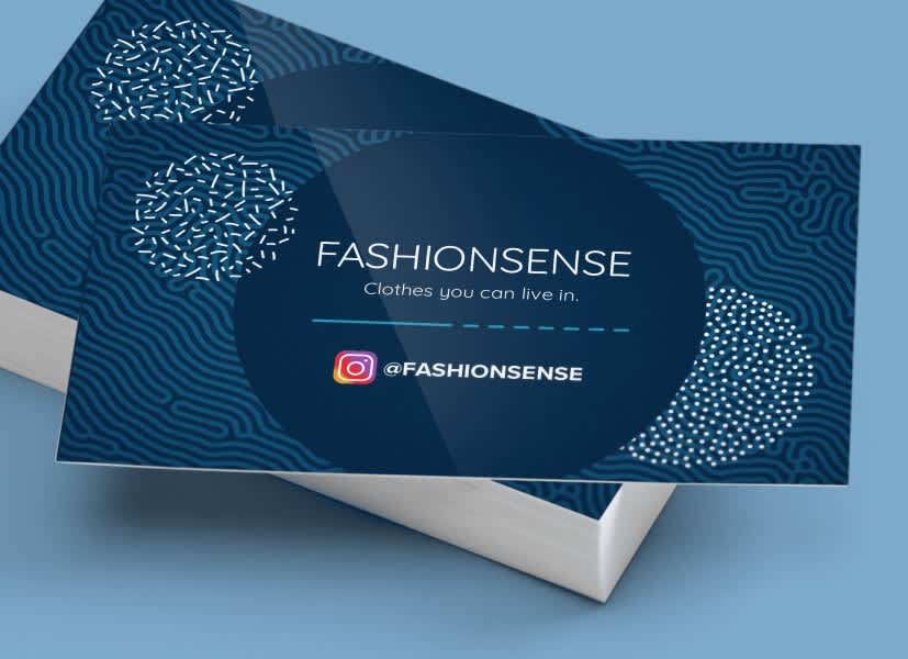 Blue Fashionsense business card with an Instagram handle, abstract fingerprint-style patterns and the tagline “Clothes you can live in.”