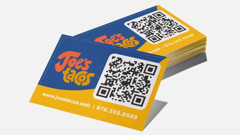 Stack of blue and yellow Joe’s Tacos QR code business cards.