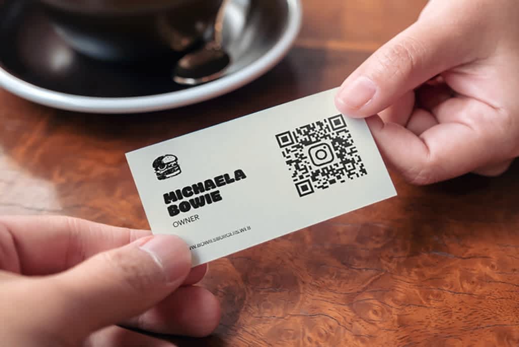 A simple business card design with a QR code.