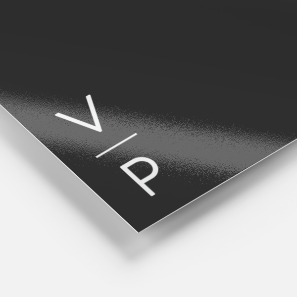 Close-up of a black packaging surface with a glossy finish