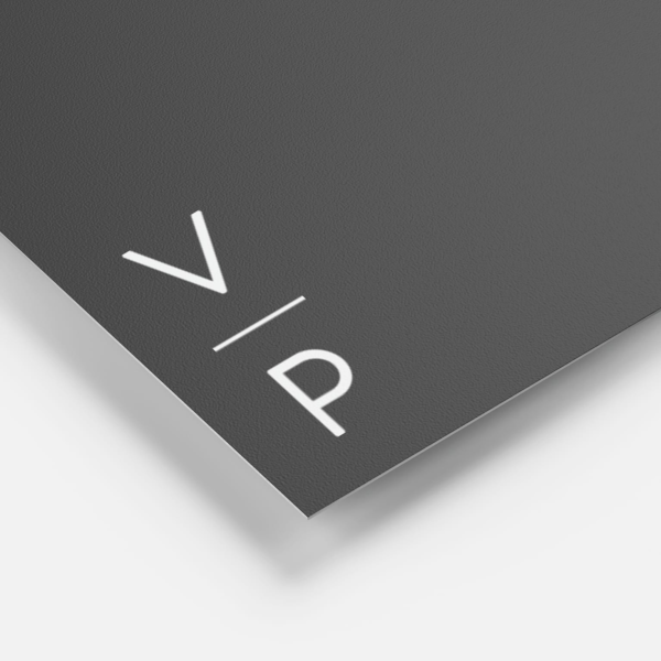 Close-up of a black packaging surface with a matte finish.