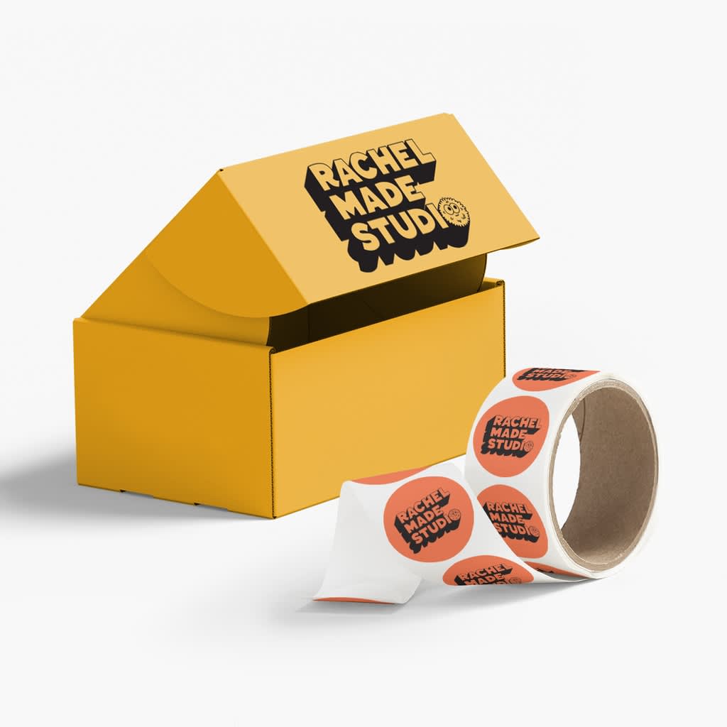 Bold yellow packaging design with a minimalist brand logo and custom stickers.