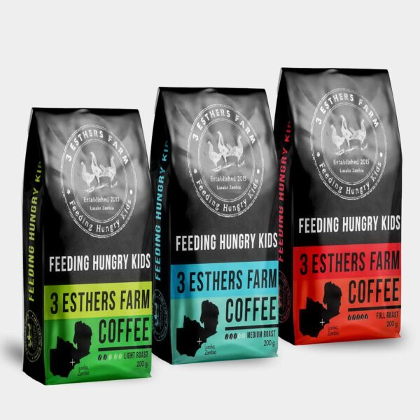Three black 3 Esthers Farm coffee pouches with green, blue and red labels for different roast levels.