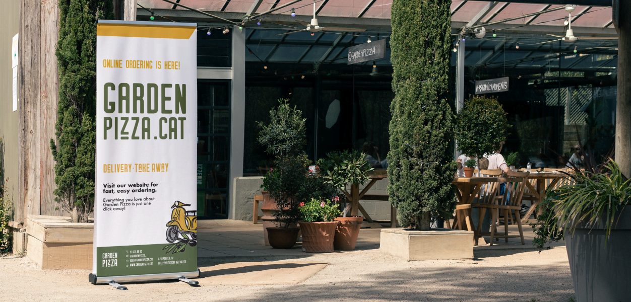 Small business storefront with large poster for offline marketing tactics