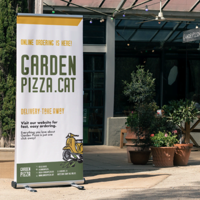 Small business storefront with large poster for offline marketing tactics