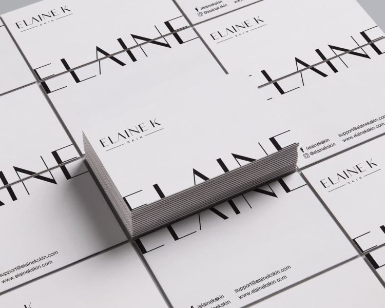 White business card with black text off the edge on front and back