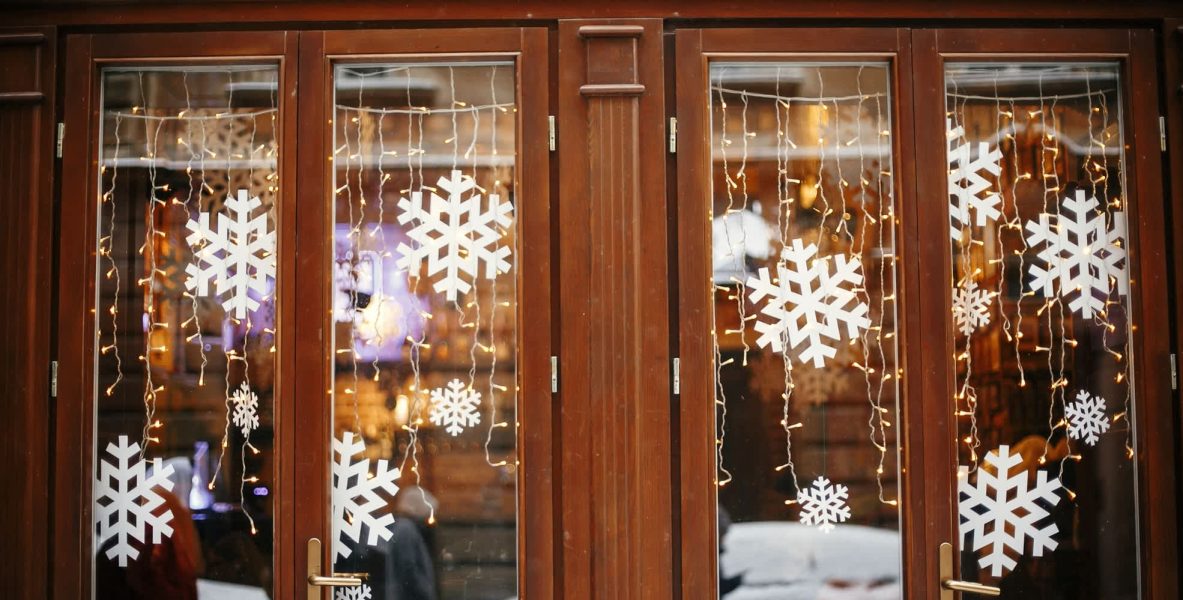 Winter street decor. Stylish lights and snowflakes