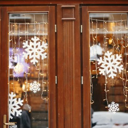 Winter street decor. Stylish lights and snowflakes