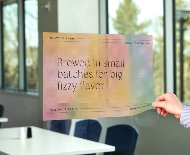 A window decal promoting a kombucha brand.