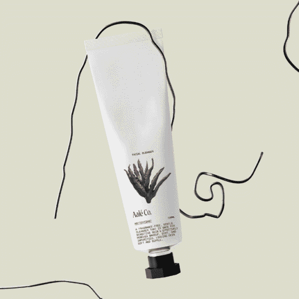An example of the Apothecary Aesthetic packaging trend 2026: minimalist skincare tube with monochrome apothecary-style label featuring a hand-drawn aloe illustration, clean typography and a soft neutral background
