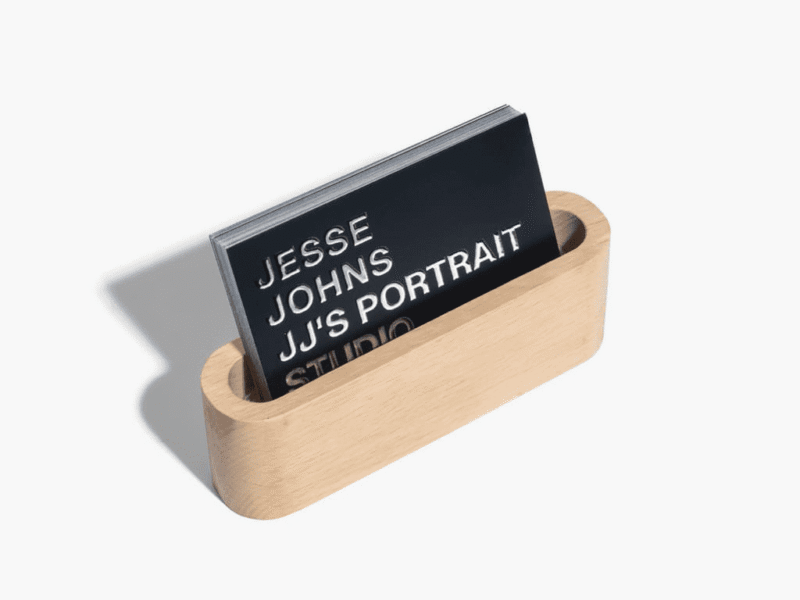Minimalist business card design with raised foil accents for a portrait photography studio