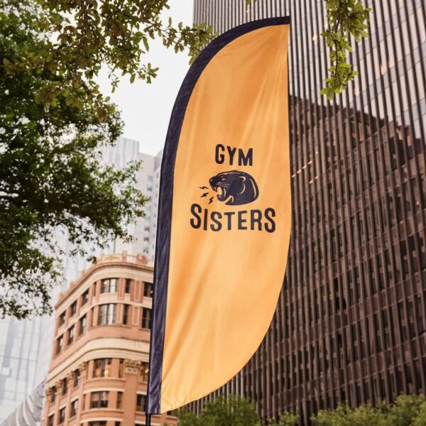 gym combination logo on street pop out sign in front of buildings