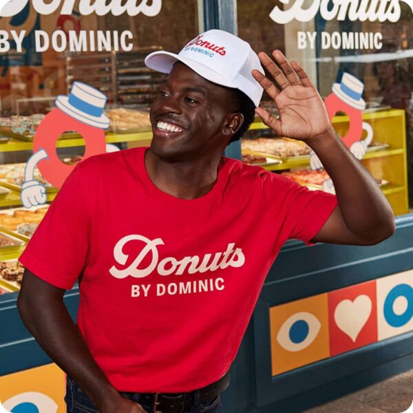 man wearing donut shop merch with logotype branding