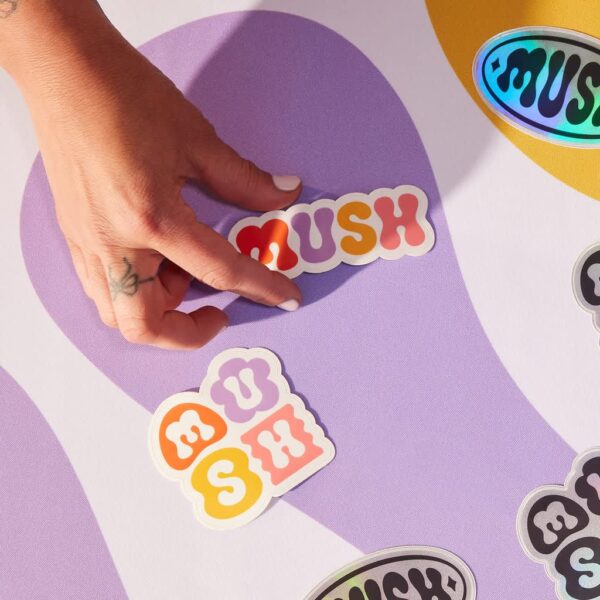 A selection of branded die-cut sticker singles with different shapes and finishes