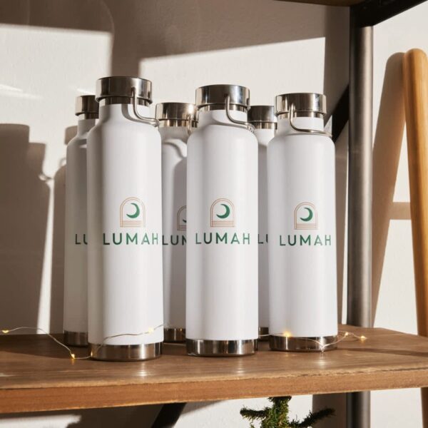White branded water bottles with the brand logo standing on a shelf