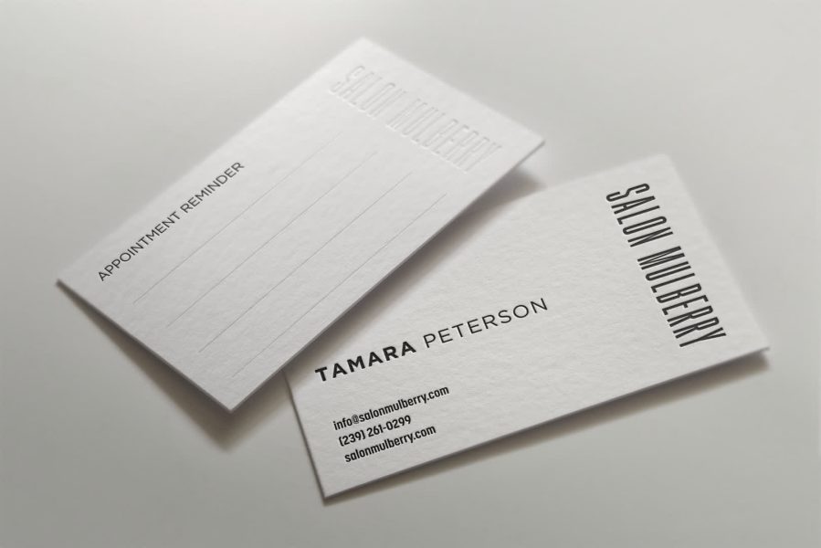 White business card with embossed name