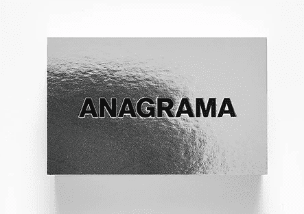 Silver metallic business card with embossed text
