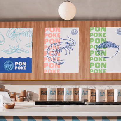 Modern poke restaurant interior with consistent branding across posters, packaging and signage