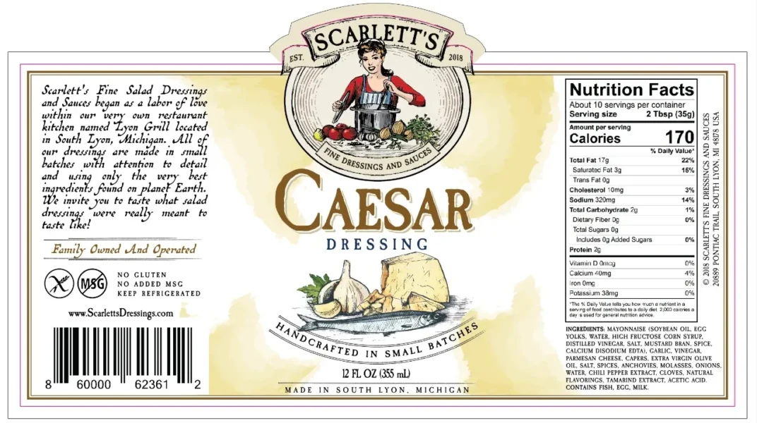 Vintage Caesar dressing label featuring a nutrition facts panel, ingredient list, barcode and handcrafted branding wrapped around a salad dressing bottle design.